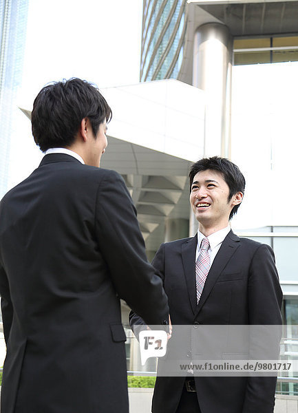 Japanese businessmen shaking hands