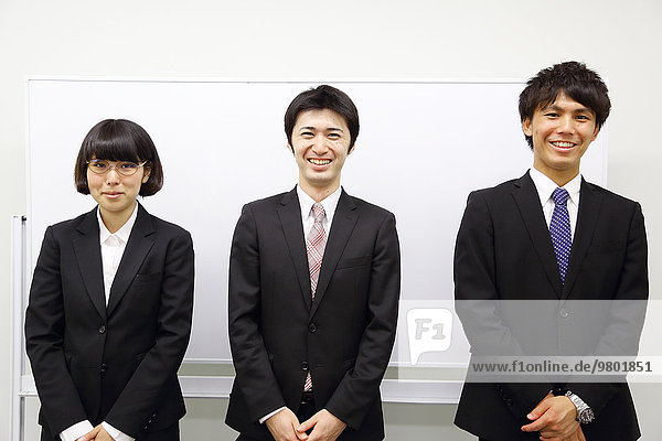 Young Japanese business people work examination