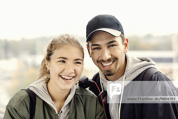 Portrait of happy young couple outdoors