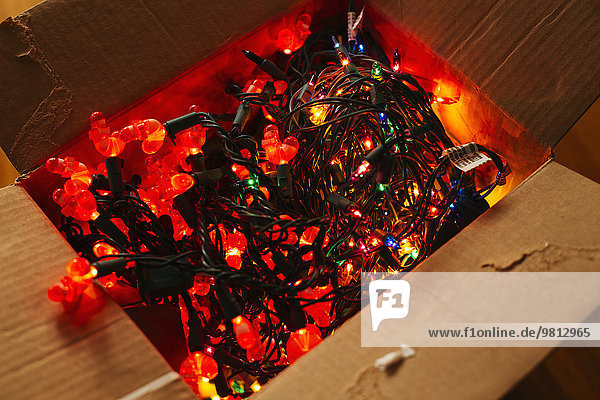 Christmas lights in cardboard box