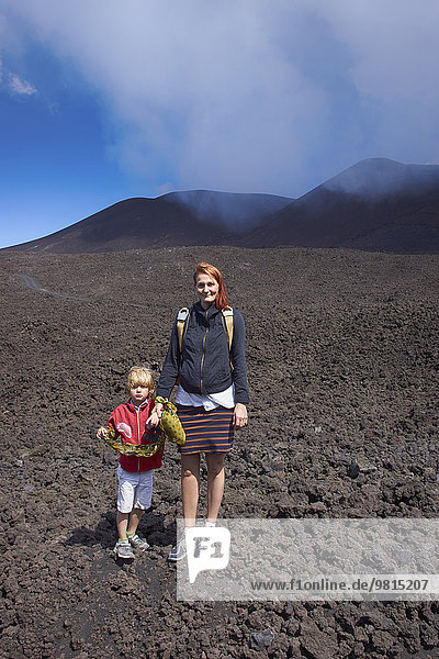 Portrait of woman and son on Mount Etna  Catania  Sicily  Italy