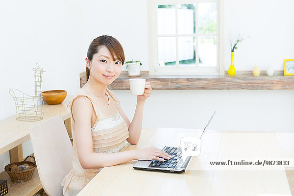 Attractive young girl working with laptop