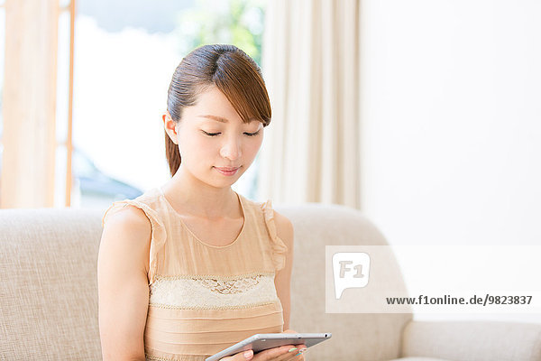 Attractive young girl with tablet