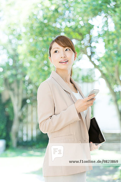 Attractive young girl with smartphone