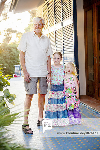 Grandfather with two granddaughters