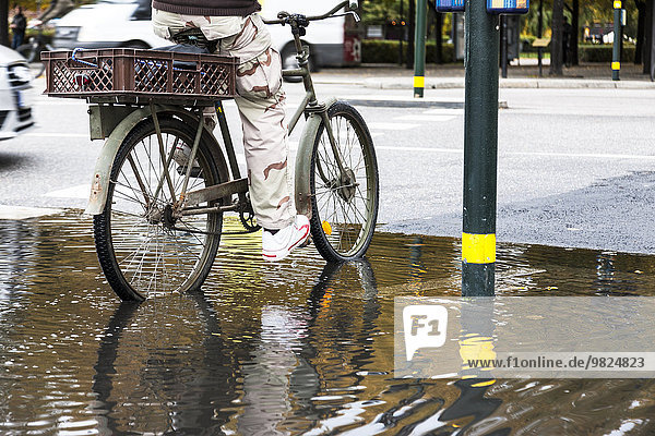radfahren Mensch Pfütze
