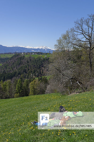 Hikers having a rest  near Wolfsgruben  Oberbozen on the Ritten Renon  Bolzano  South Tyrol  Italy  Europe