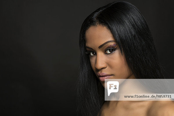 Young woman with long black hair  beauty portrait