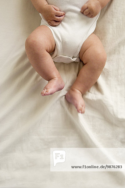 Close up of legs of mixed race baby boy