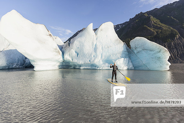 Person paddleboarding at Grewingk Glacier  Kachemak Bay State Park  Southcentral Alaska