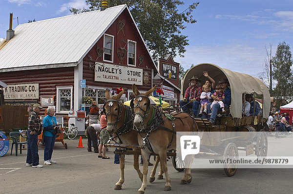 Horse-Drawn Wagon In The Talkeetna Moose Dropping Festival Parade During Summer In Alaska
