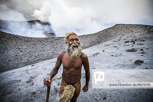 'A local landowner standing at the rim of Yasur Volcano; Tanna Island  Vanuatu'