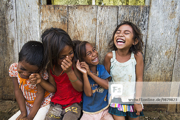 'Children sharing a laugh; Baucau  Timor-Leste'