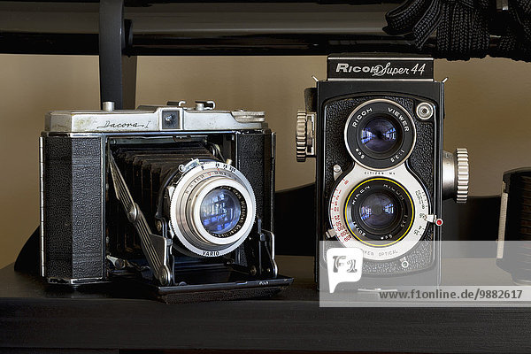 Close-up of two cameras