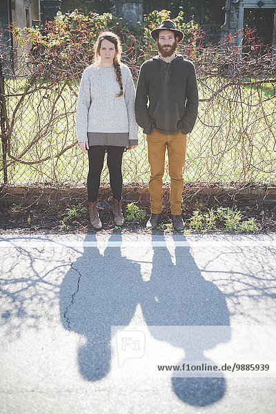 Young couple side by side  portrait