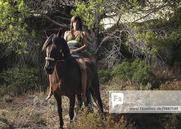 Woman horseback riding; Tarifa  Cadiz  Andalusia  Spain