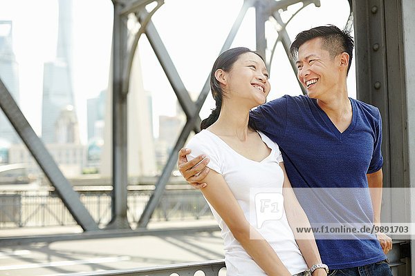 Smiling romantic tourist couple  The Bund  Shanghai  China