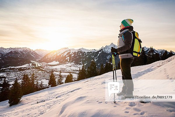 Young female hiker looking out from mountainside  Reutte  Tyrol  Austria
