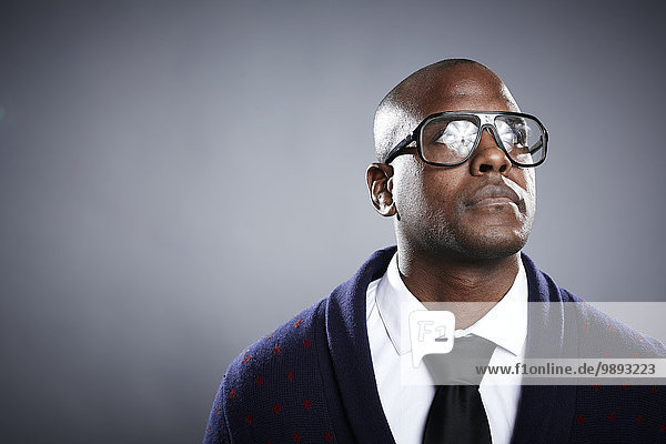 Portrait of young man wearing eyeglasses