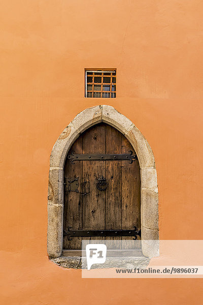 Germany  Passau  historic wooden door of an old building with orange facade