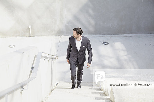 Businessman going upstairs in a modern building