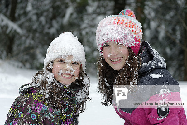 Two girls having fun in the snow