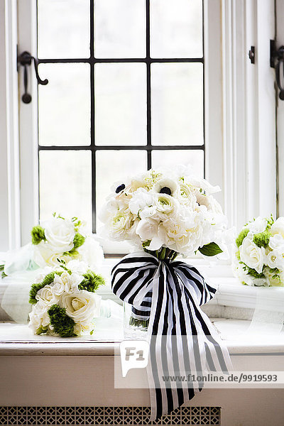 Close-up of Bridal bouquets with stripped ribbon  ready on window sill for Wedding  Canada