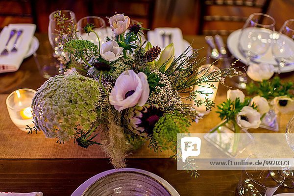 Flower arrangement on dinner party table