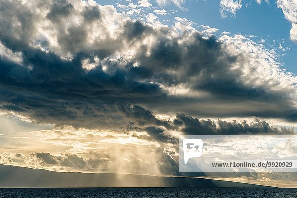 Seascape of sunbeams and storm clouds  Maui  Hawaii