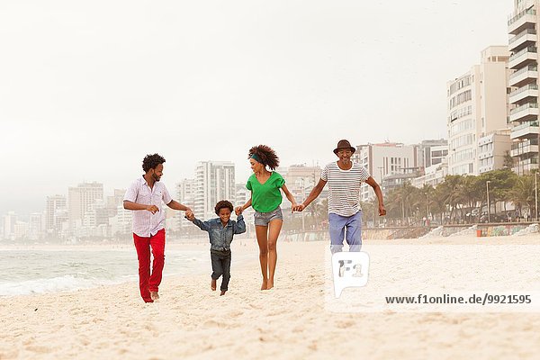 Three generation family enjoying beach  Rio de Janeiro  Brazil