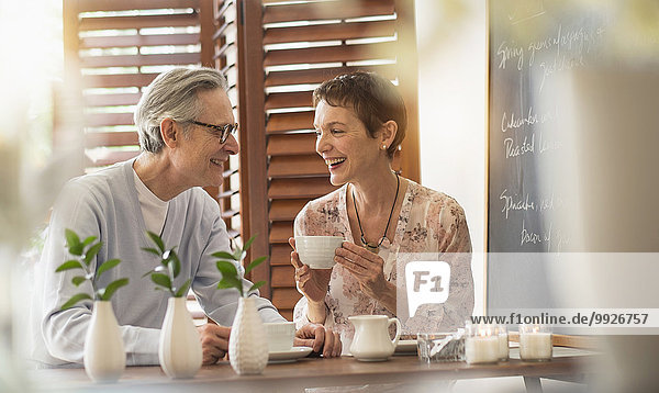 Senior couple talking at restaurant