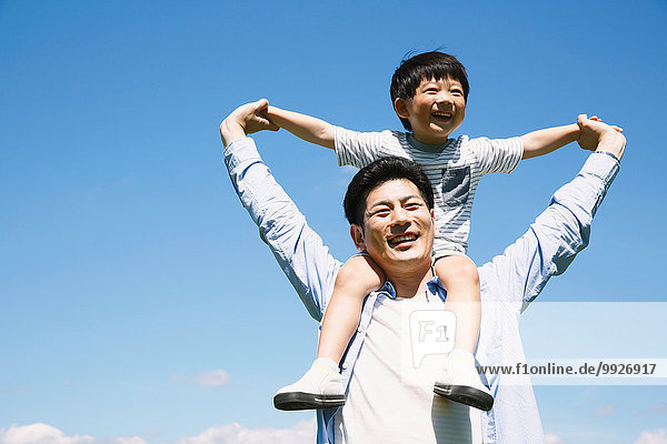 Japanese father and son laughing