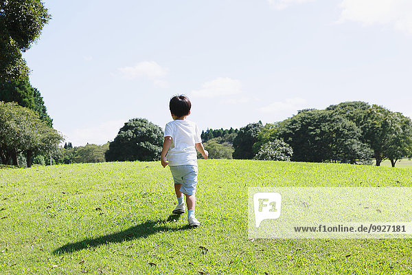 Japanese young boy in a city park