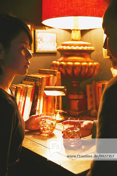 Couple drinking in a fashionable bar