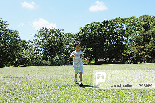 Japanese young boy in a city park