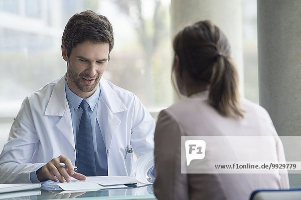 Doctor meeting with patient in office