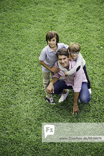 Father and sons together outdoors  portrait