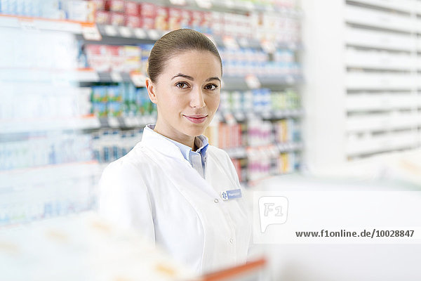 Portrait of confident pharmacist in pharmacy
