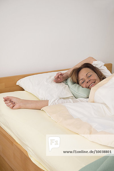 Senior woman sleeping in her bedroom  Munich  Bavaria  Germany
