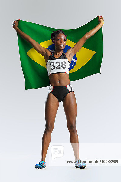 Female Athlete Holding a Brazilian Flag