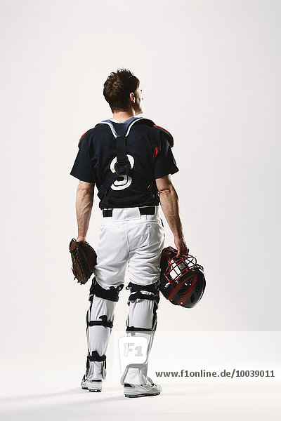 Baseball catcher against white background