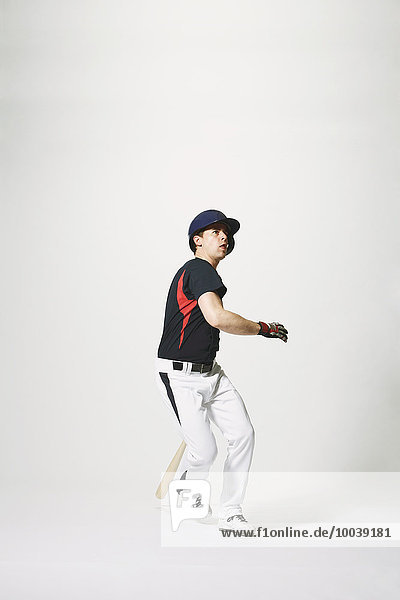 Baseball batter against white background