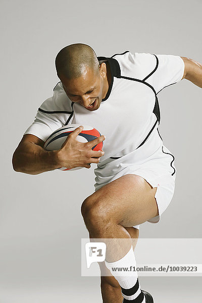 Bald male rugby player
