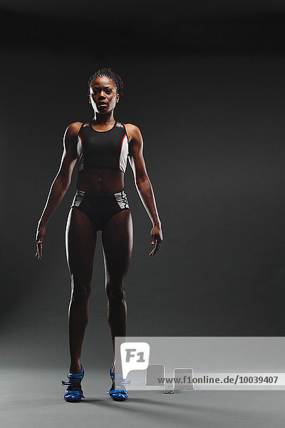 African Female Athlete Exercising  Studio Shot