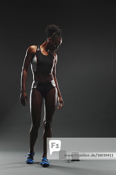 African Female Athlete Exercising  Studio Shot