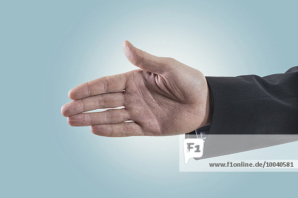 Businessman extending hand for handshake  Bavaria  Germany