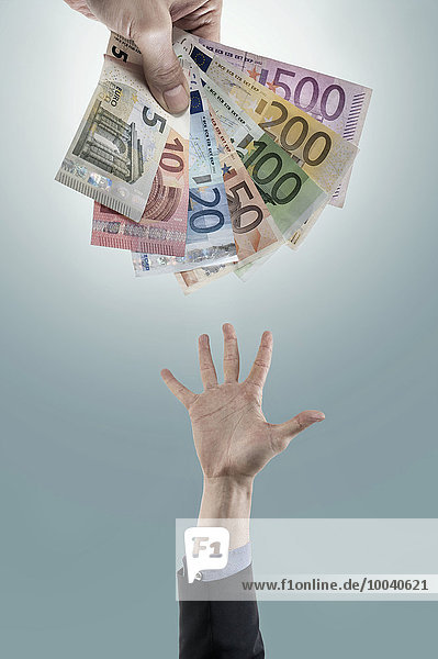 Hand reaching out for money,  Bavaria,  Germany