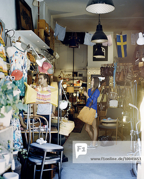 Young woman in second hand store