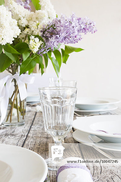 Laid table with lilac