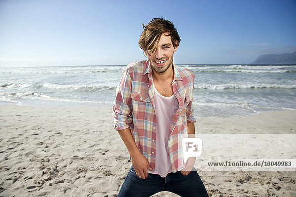 Happy young man on beach